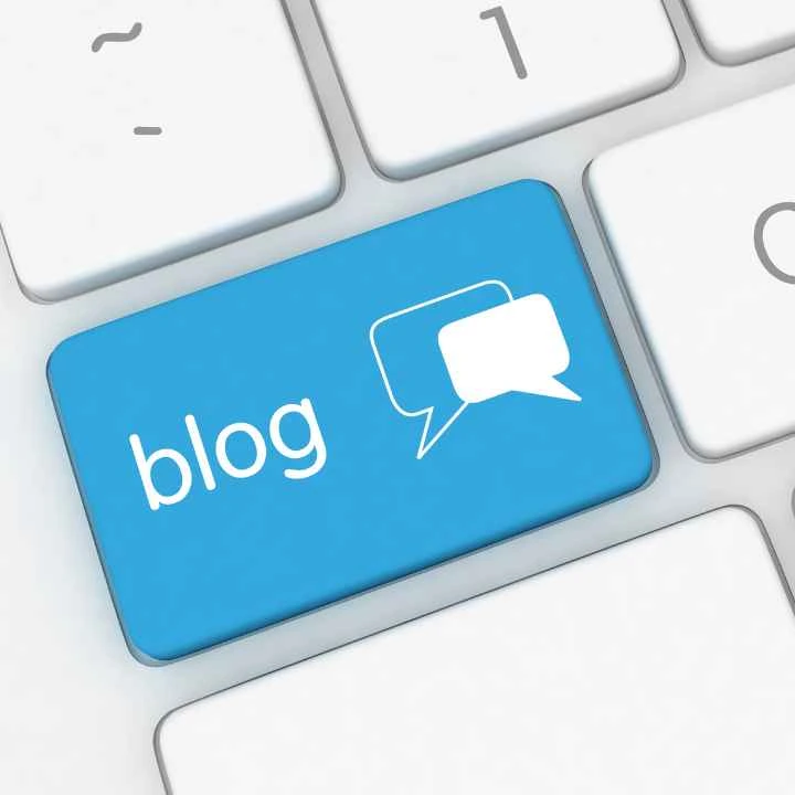 Blue blog key on a computer keyboard representing digital content and industry insights